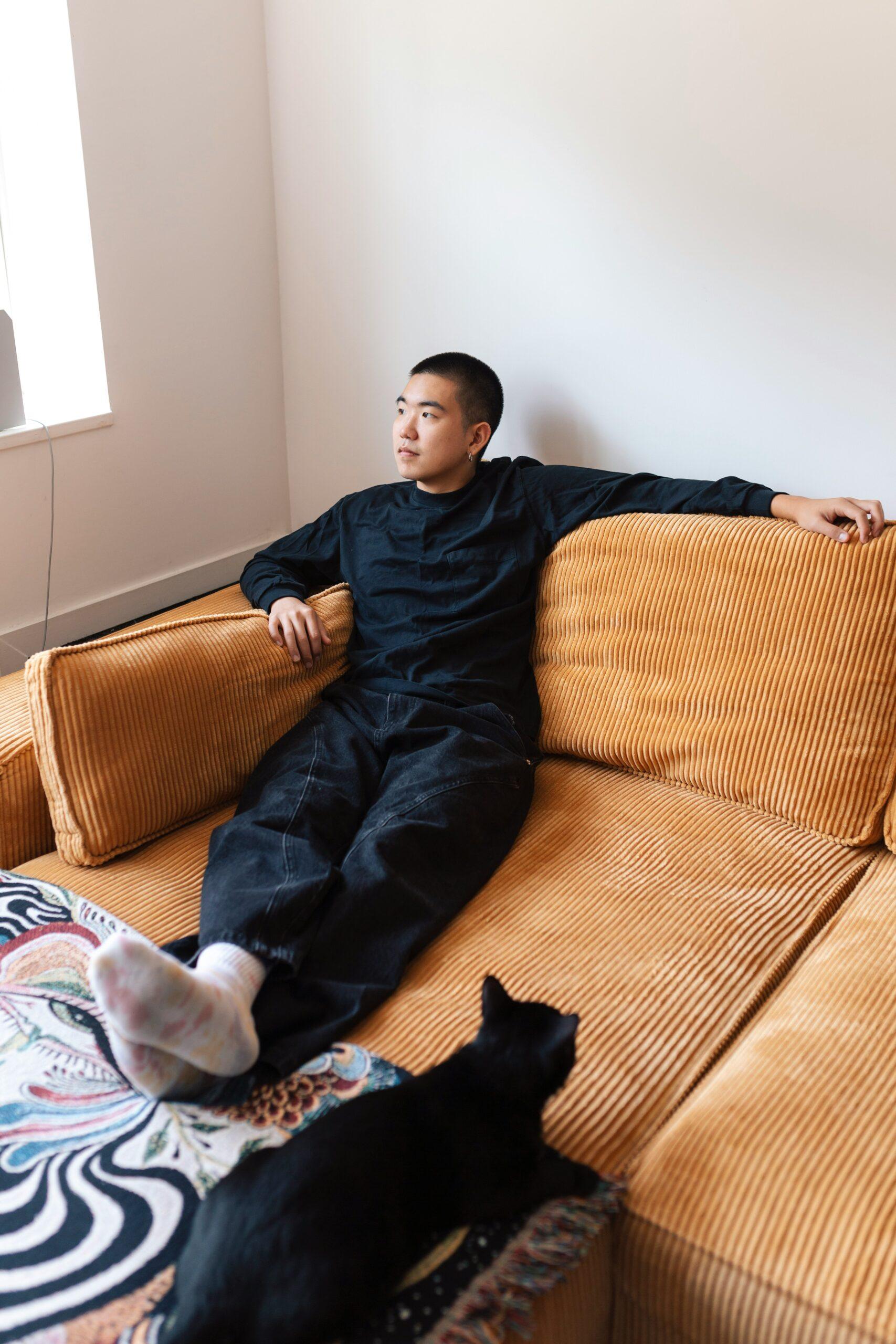 job burnout recovery requires rest to go beyond getting back to productiveness; a person resting with a cat.